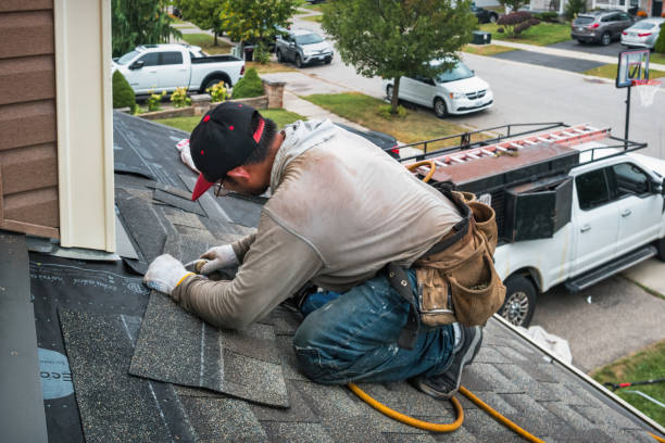 Professional Roofing technician working in Orleans, VT